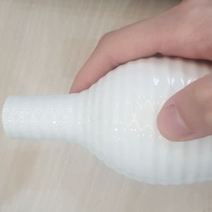 Simple small white flower vase with long neck